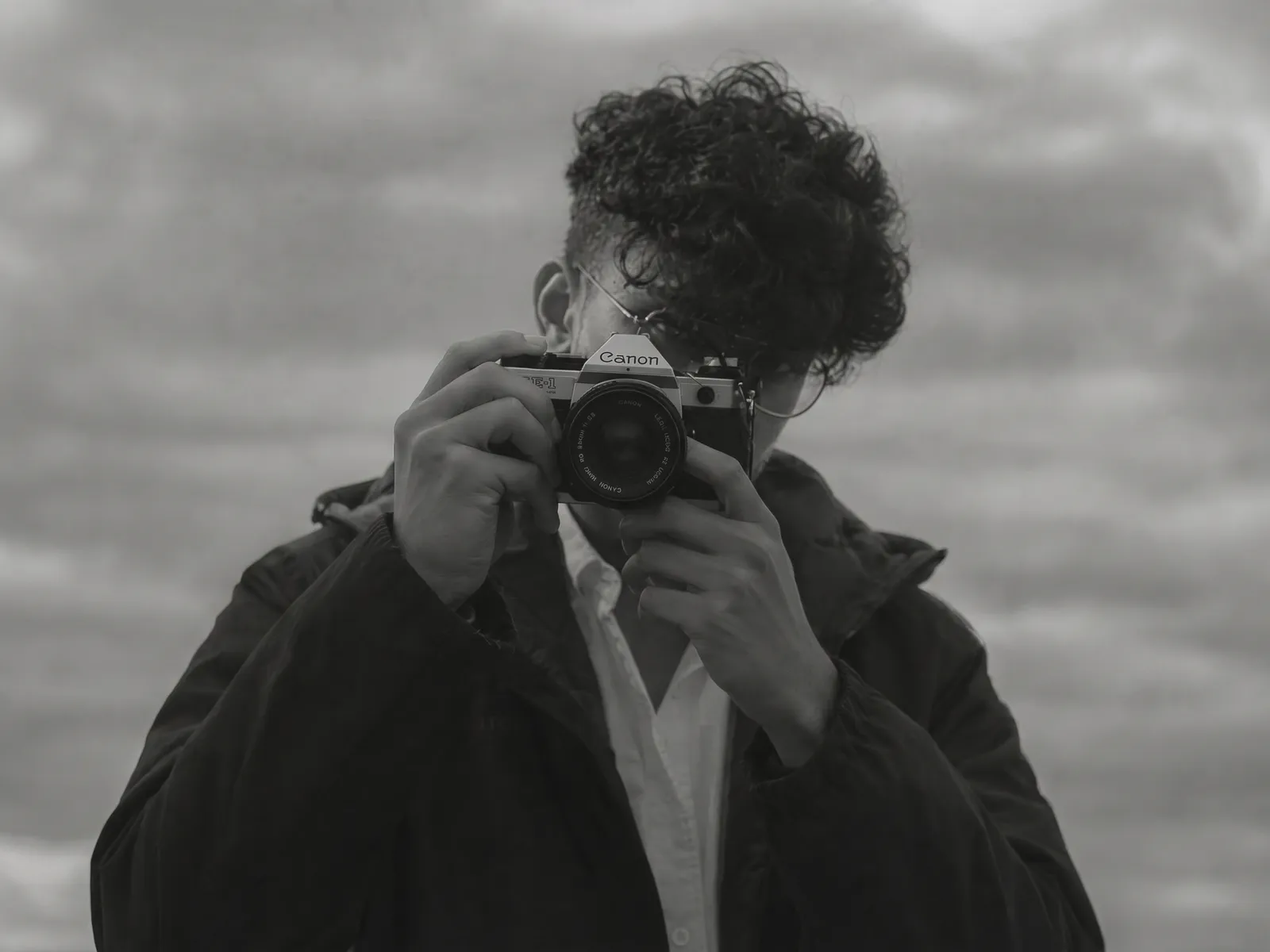 Najah Luthfi raising a Canon film camera